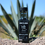 The black ML bottle in the fields